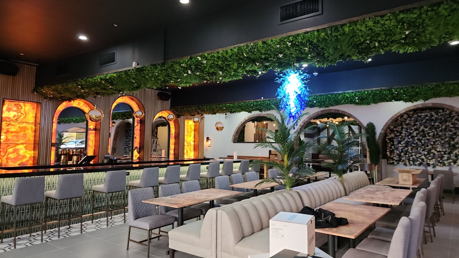 Room install with surface mount speakers, CCTV, POS, and lighting by JRO Solutions.