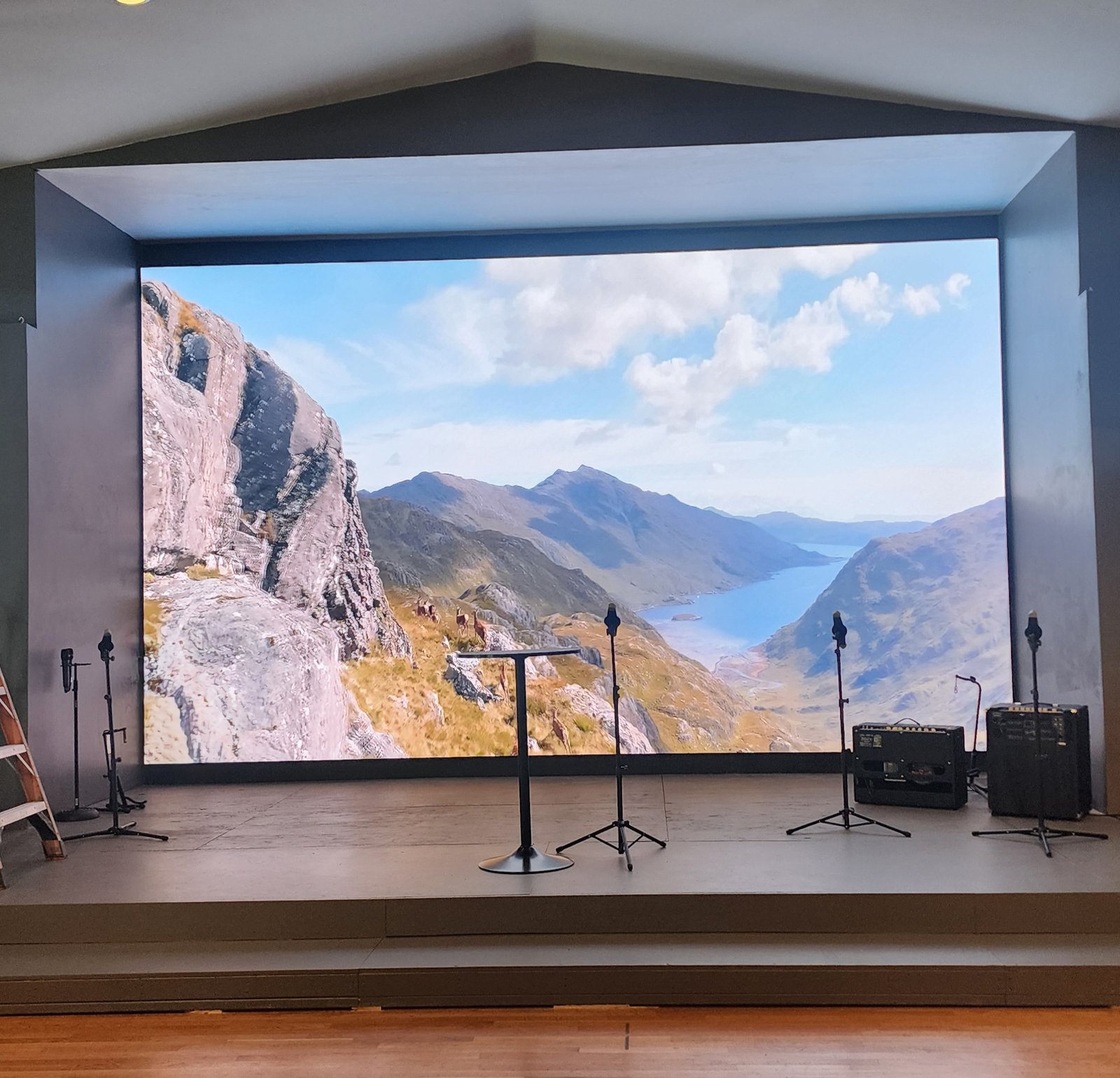 Church stage with LED video wall and DMX spot lights installed by JRO Solutions.