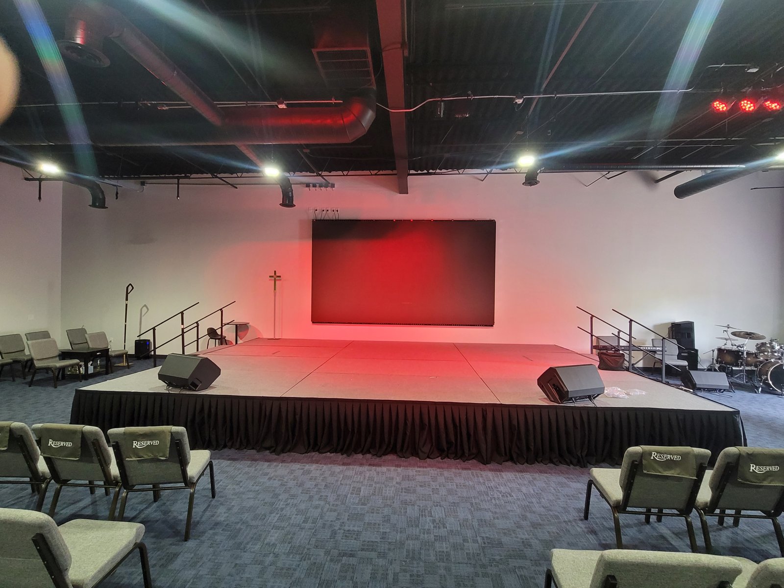 LED video wall installation and configuration with stage lights by JRO Solutions.